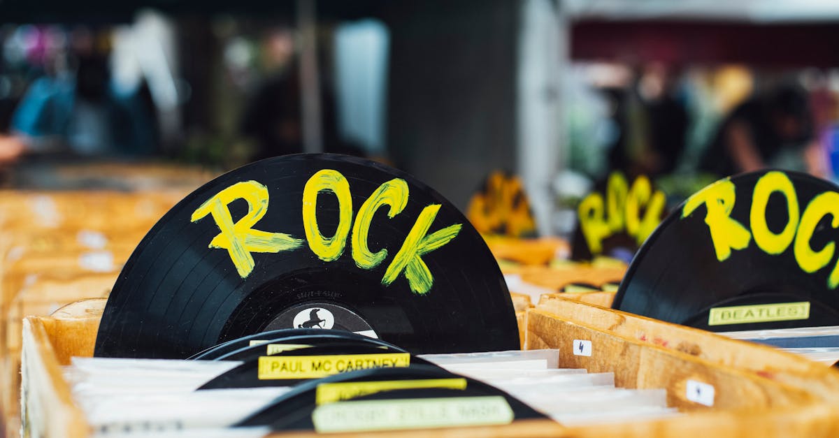 Colorful vinyl records labeled 'Rock' in a vintage music shop, perfect for music enthusiasts.